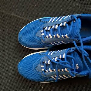 Adidas Blue Athletic Shoes with Breathable Fabric and White Stripes